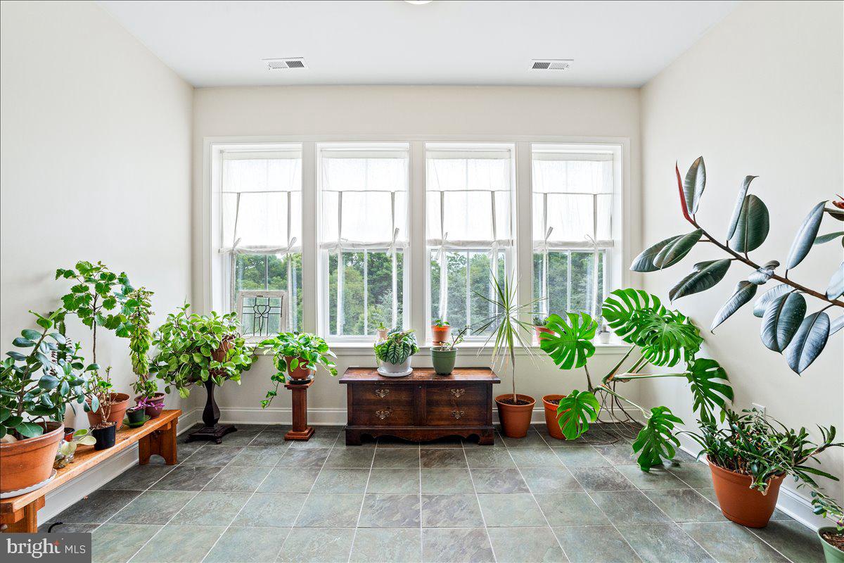 2250 Bear Den Road, Unit 313 Frederick, MD 21701 - Photo 5 of 59 a living room with furniture and flowers