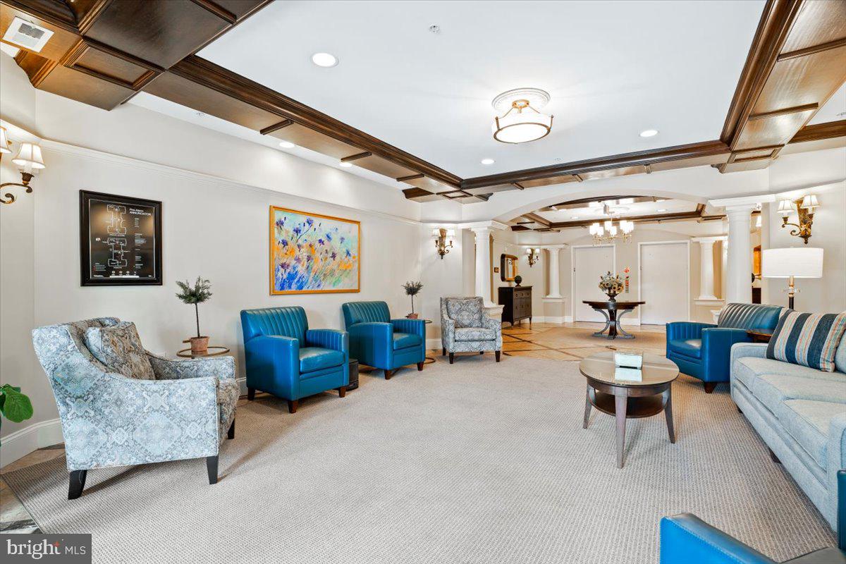 2250 Bear Den Road, Unit 313 Frederick, MD 21701 - Photo 53 of 59 a living room with furniture and a chandelier