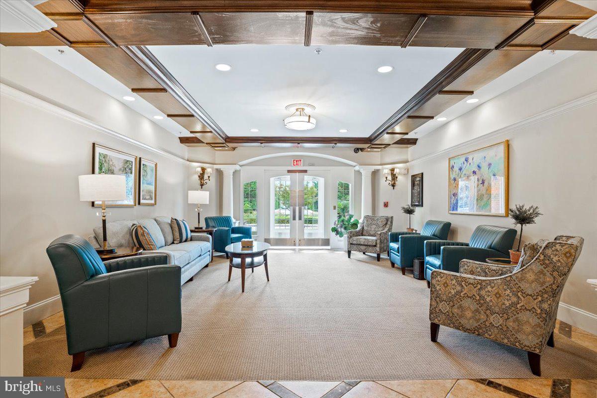 2250 Bear Den Road, Unit 313 Frederick, MD 21701 - Photo 54 of 59 a living room with furniture and a large window
