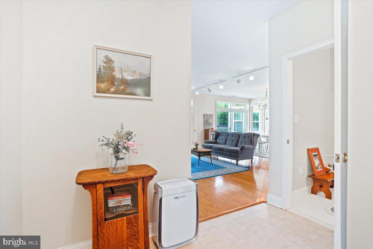 2250 Bear Den Road, Unit 313 Frederick, MD 21701 - Photo 56 of 59 a living room with furniture and a dining table