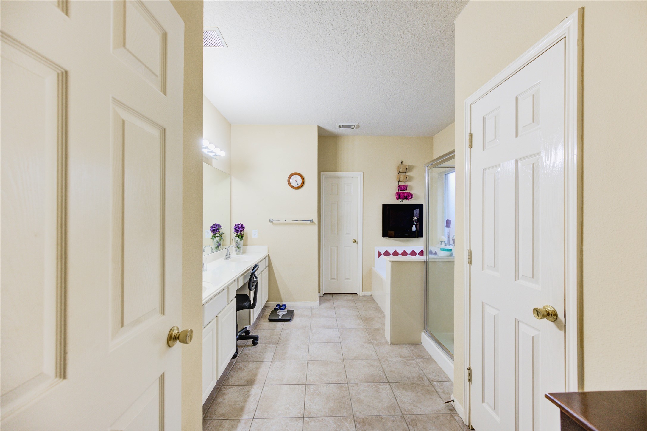16730 Spring Barker Drive Cypress, TX 77429 - Photo 39 of 50 a view of a hallway with white walls and a wooden floor