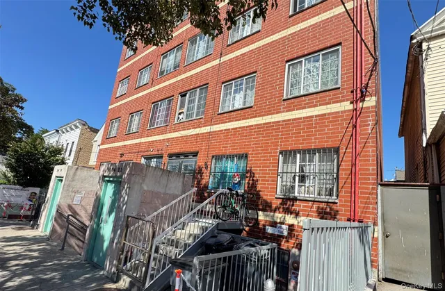 a kitchen with refrigerator and cabinets