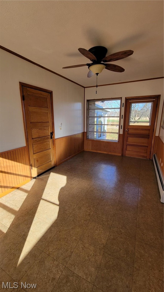 405 Bryan Road Milan, OH 44846 - Photo 19 of 35 Breezeway featuring a baseboard heating unit, linoleum floors, and ceiling fan