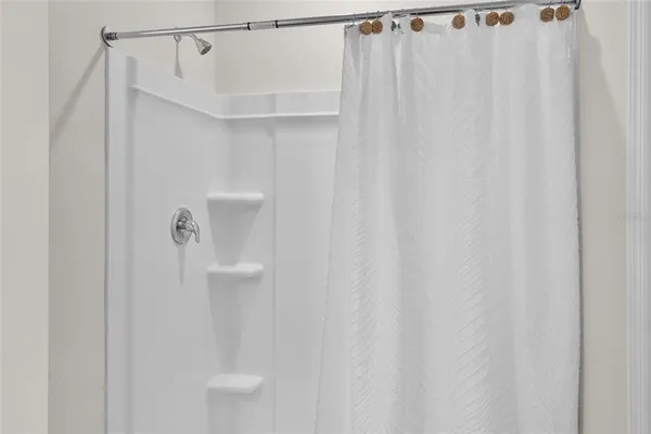 a bathroom with a shower curtain