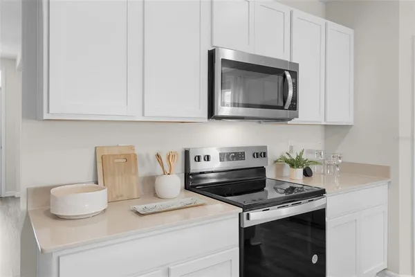 a kitchen with a stove and a microwave