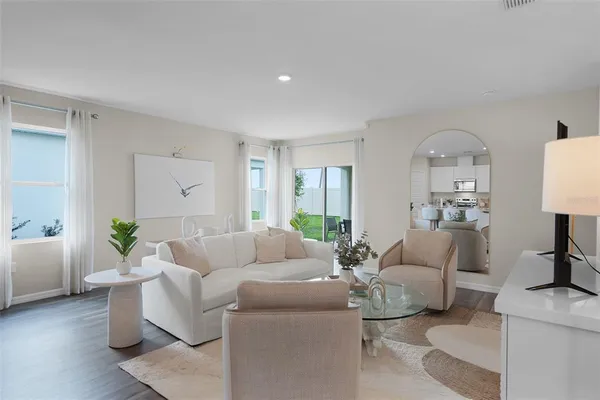 a living room with furniture and a large window