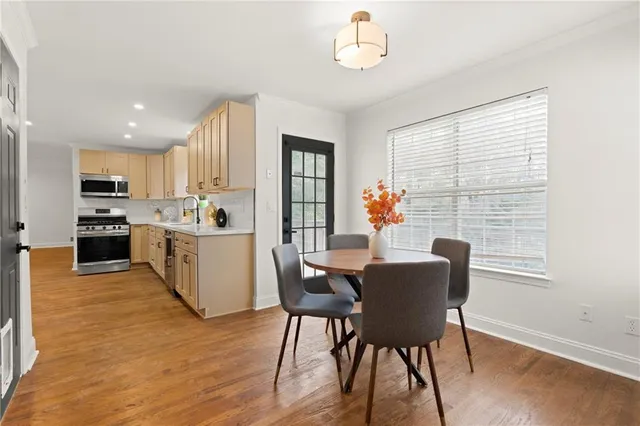 an empty room with a window and a ceiling fan