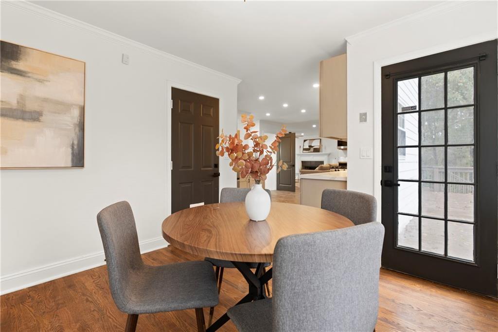 560 Flowering Trail Grayson, GA 30017 - Photo 18 of 68 a dining room with furniture and wooden floor