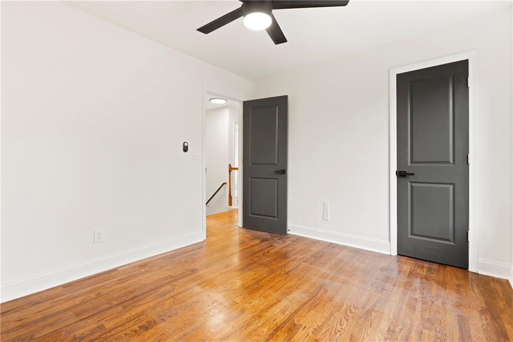 560 Flowering Trail Grayson, GA 30017 - Photo 26 of 68 a view of empty room with wooden floor
