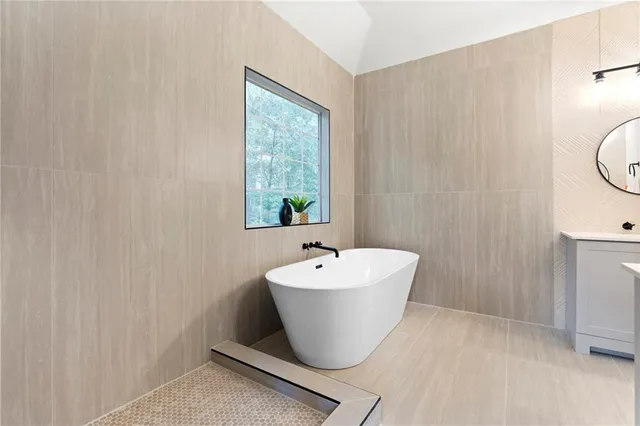 a view of a small space with wooden floor and a window