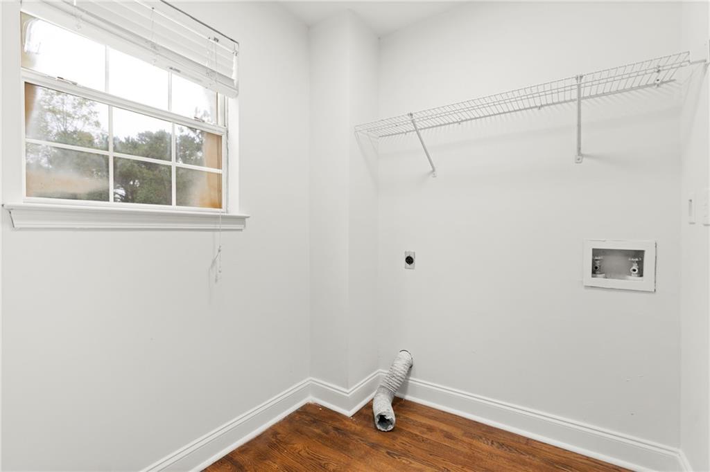 560 Flowering Trail Grayson, GA 30017 - Photo 37 of 68 a view of a small space with wooden floor and a window