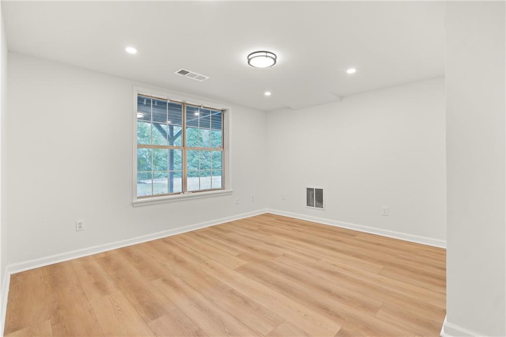 560 Flowering Trail Grayson, GA 30017 - Photo 39 of 68 a view of an empty room with a window