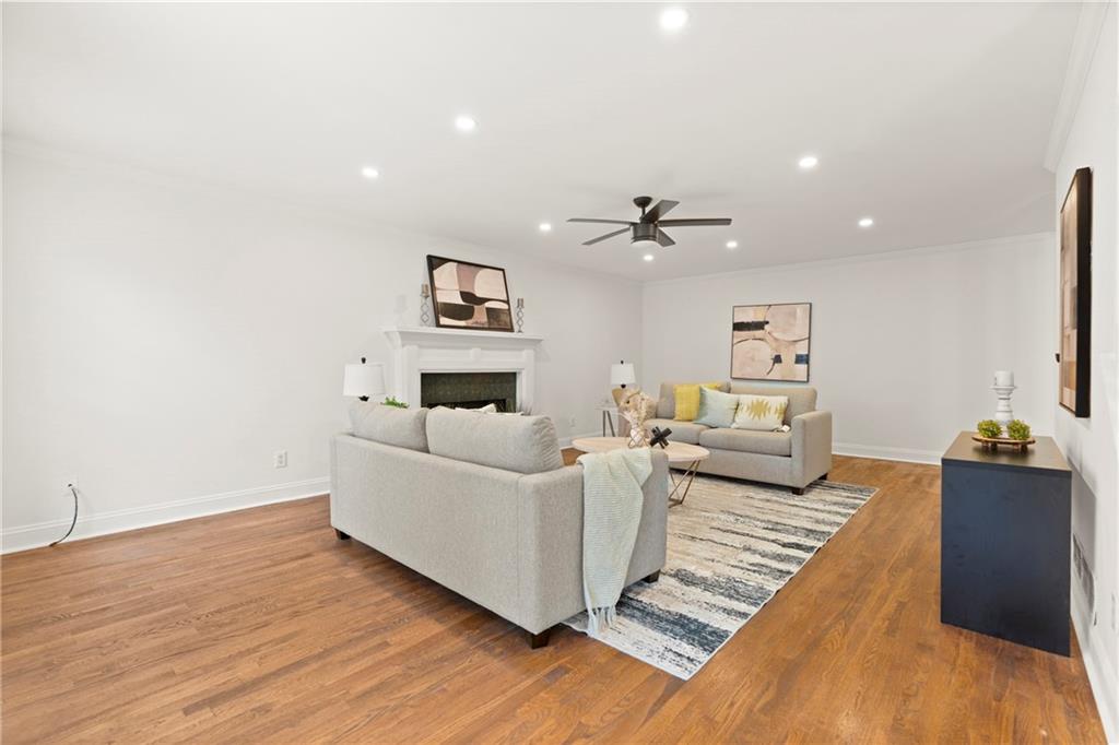 560 Flowering Trail Grayson, GA 30017 - Photo 4 of 68 a living room with furniture and wooden floor
