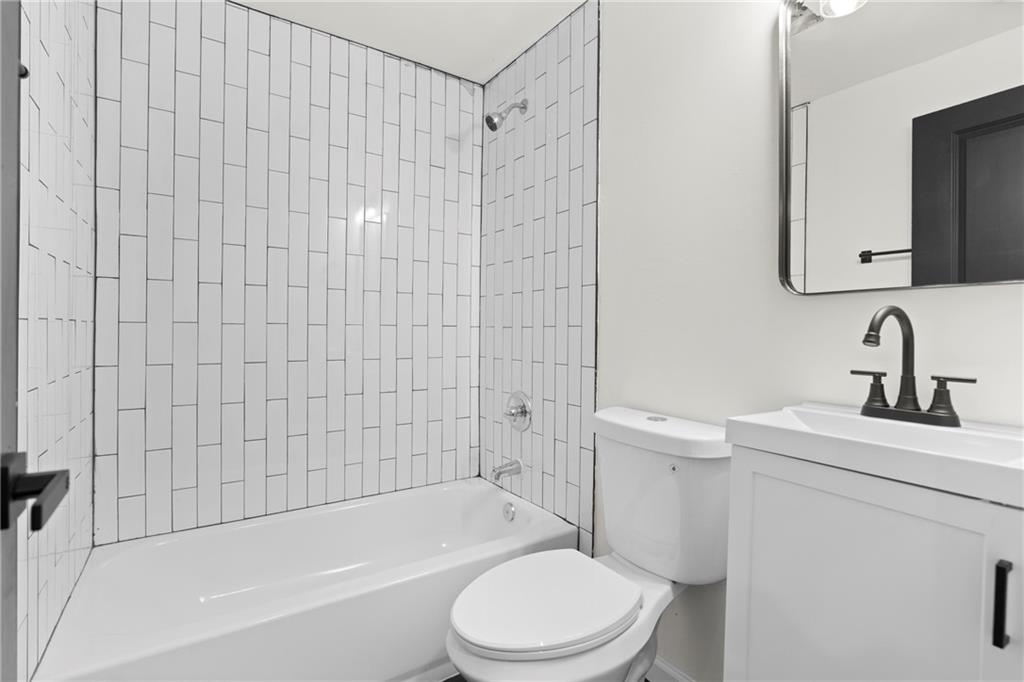 560 Flowering Trail Grayson, GA 30017 - Photo 41 of 68 a bathroom with a sink toilet and shower