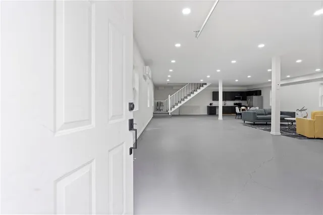 a view of a house with a yard and sitting area