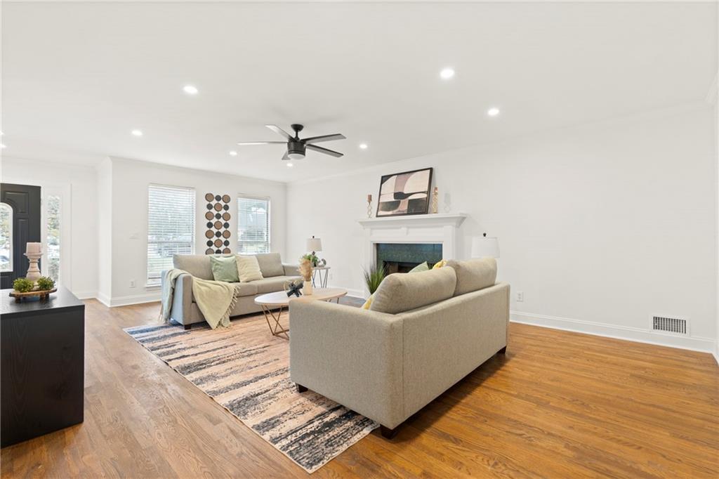 560 Flowering Trail Grayson, GA 30017 - Photo 5 of 68 a living room with furniture and a wooden floor