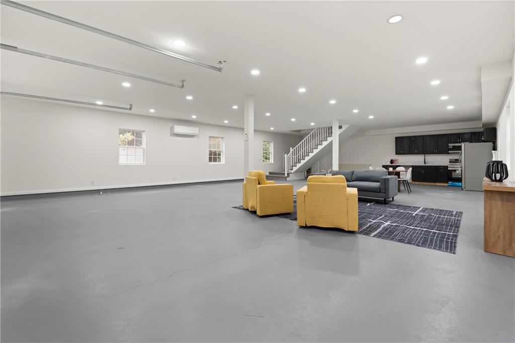 560 Flowering Trail Grayson, GA 30017 - Photo 52 of 68 a living room with furniture and a couch
