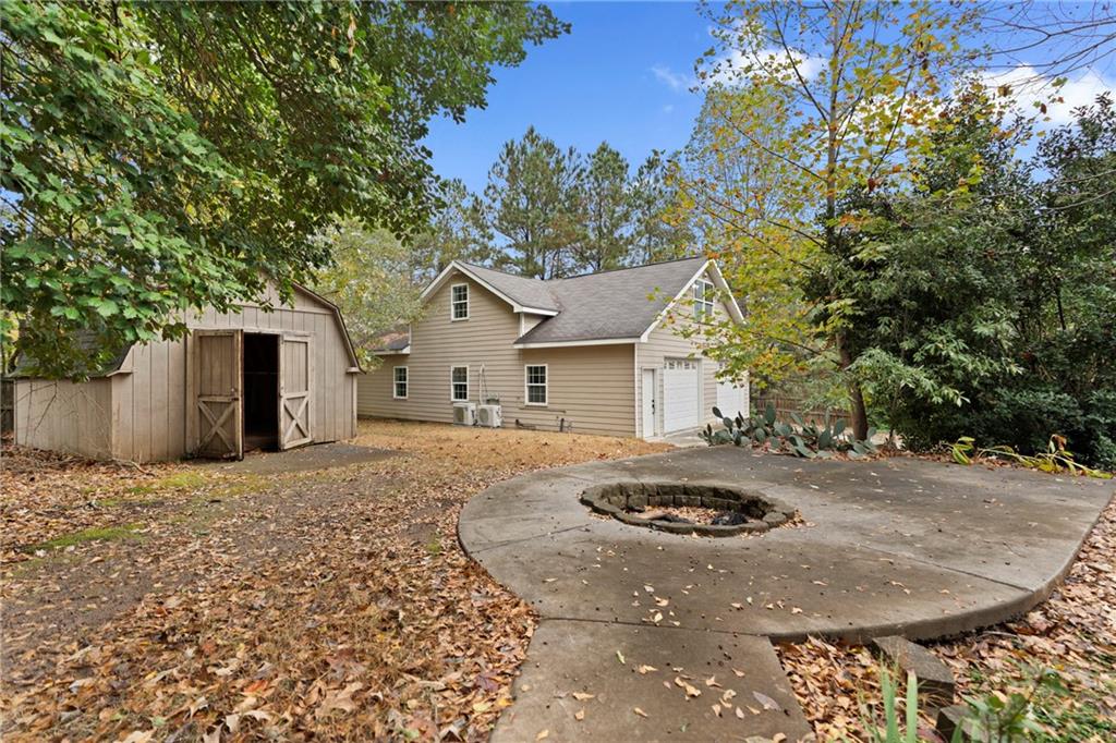 560 Flowering Trail Grayson, GA 30017 - Photo 60 of 68 a view of a house with backyard