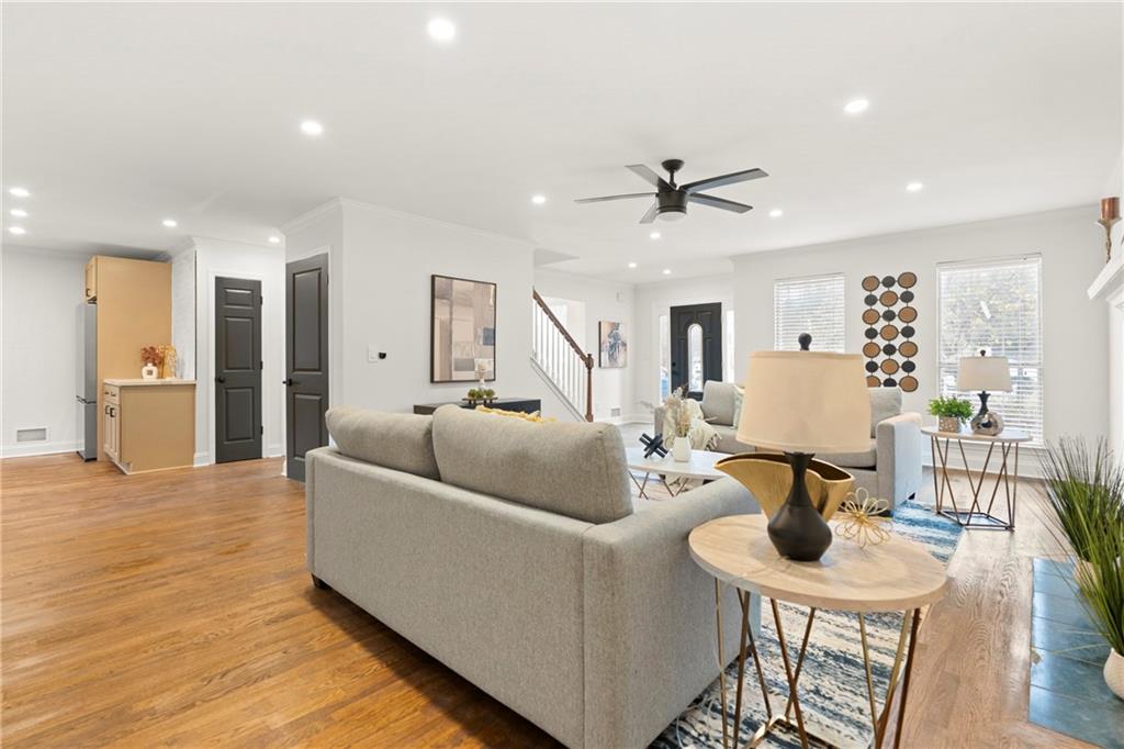 560 Flowering Trail Grayson, GA 30017 - Photo 6 of 68 a living room with furniture and wooden floor
