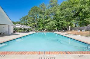 560 Flowering Trail Grayson, GA 30017 - Photo 66 of 68 a view of a swimming pool with an outdoor seating