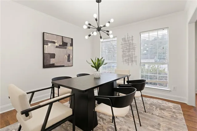 a view of a dining room with furniture window and wooden floor
