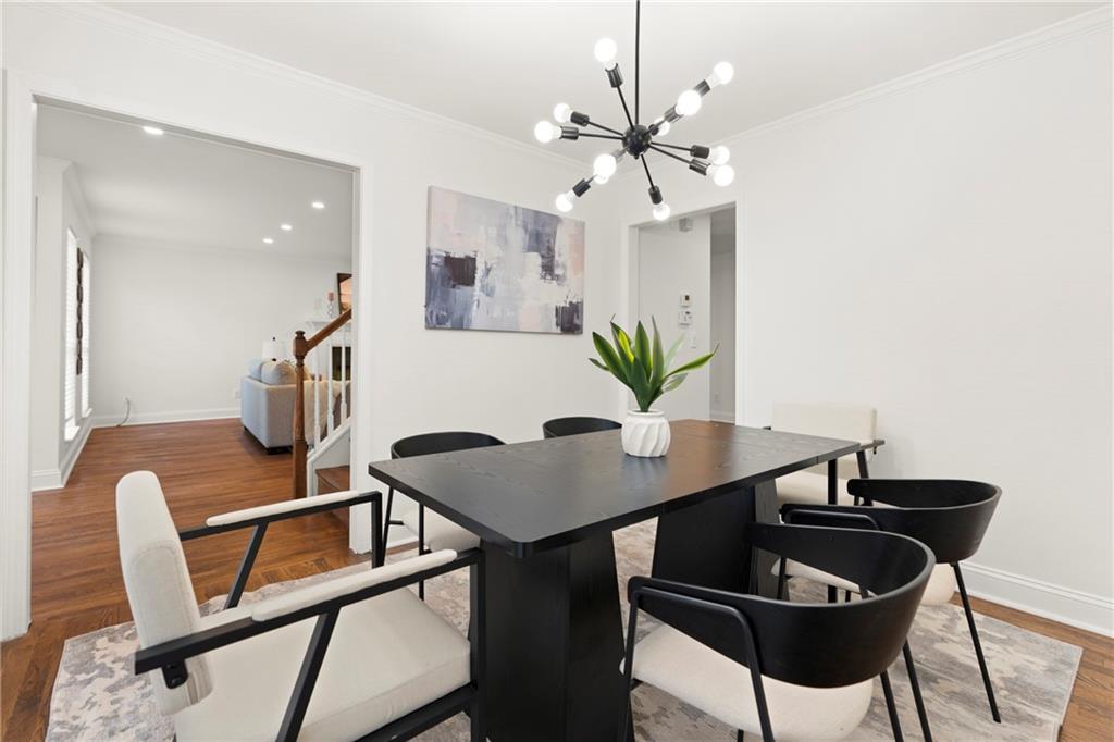 560 Flowering Trail Grayson, GA 30017 - Photo 9 of 68 a view of a dining room with furniture and wooden floor