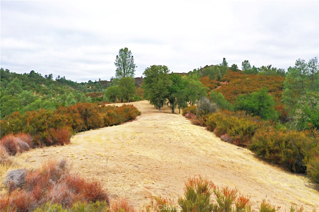 76370 Bryson Hesperia Road Bradley, CA 93426 - Photo 21 of 23 a view of a lake with a mountain in the background