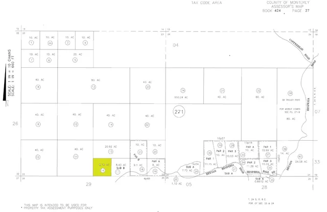 an aerial view of residential house with outdoor space and trees all around