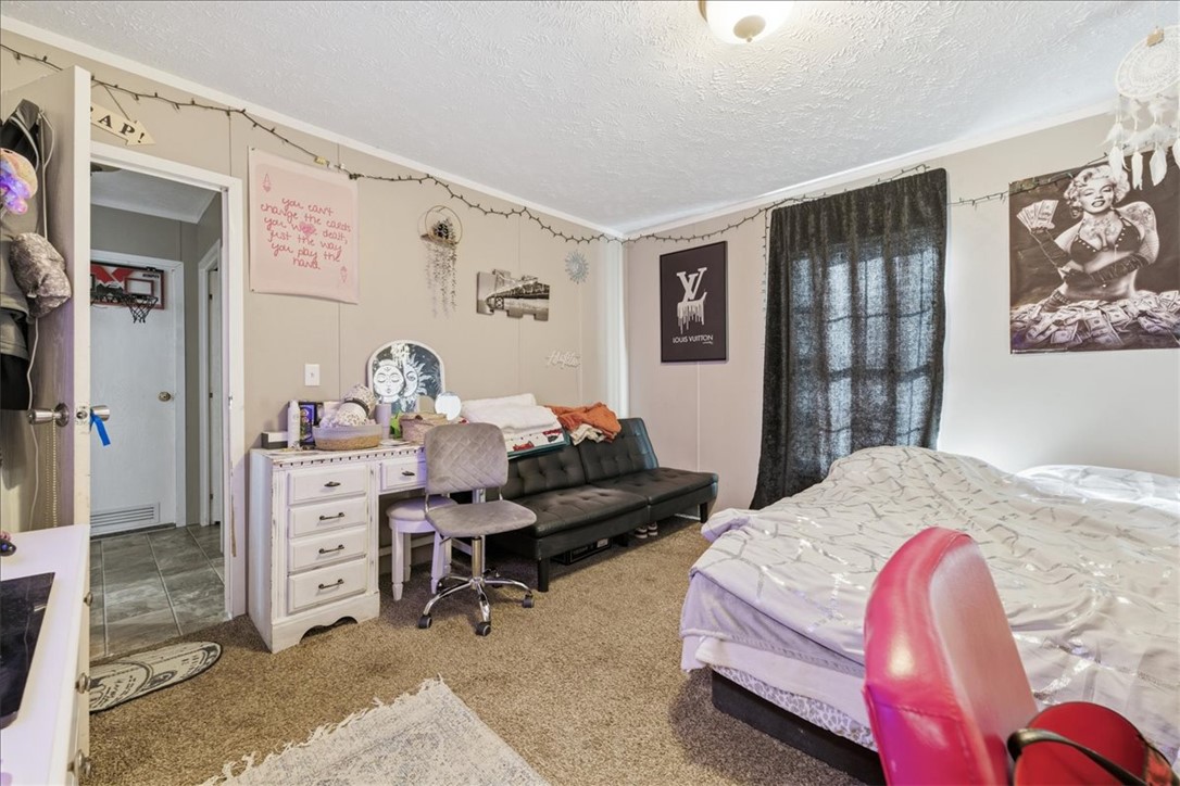 616 Anderson Road Pendleton, SC 29670 - Photo 13 of 29 This cozy bedroom features comfortable carpeting, perfect for quiet relaxation.