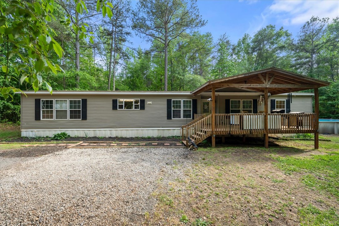 616 Anderson Road Pendleton, SC 29670 - Photo 18 of 29 This tranquil property features a welcoming porch, perfect for enjoying the surrounding natural beauty.