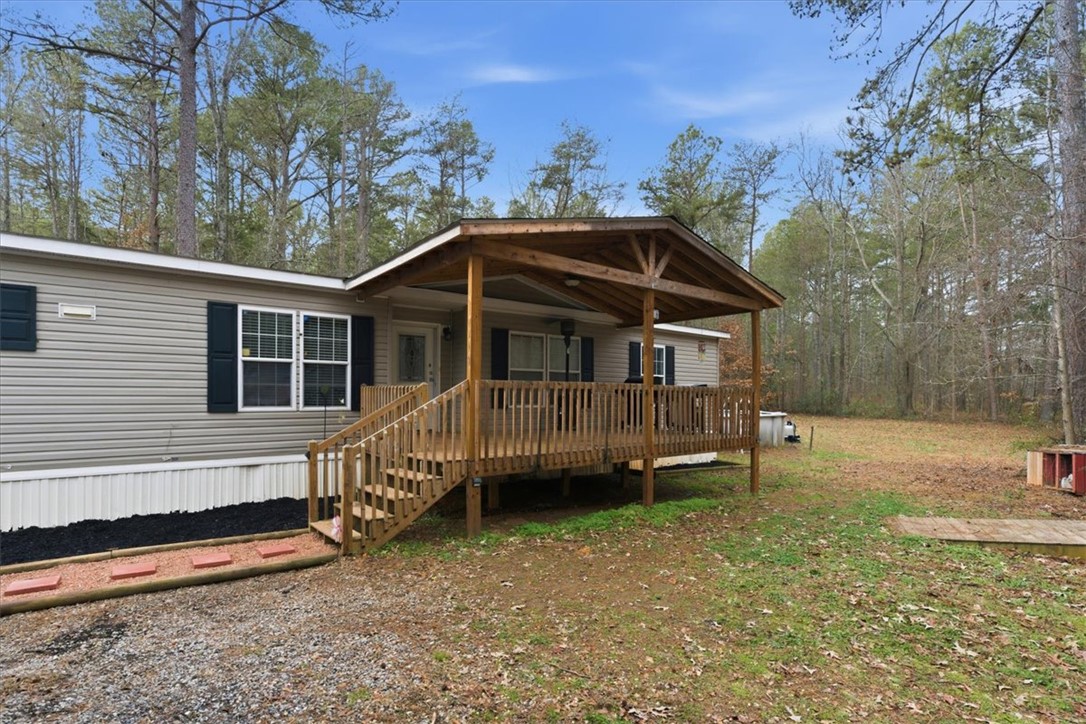 616 Anderson Road Pendleton, SC 29670 - Photo 2 of 29 This charming home features a lovely front porch, offering a warm welcome amidst a natural setting.