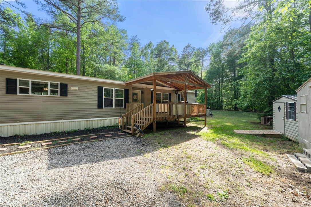 616 Anderson Road Pendleton, SC 29670 - Photo 22 of 29 This charming home features a welcoming covered porch, perfect for enjoying the serene wooded surroundings.