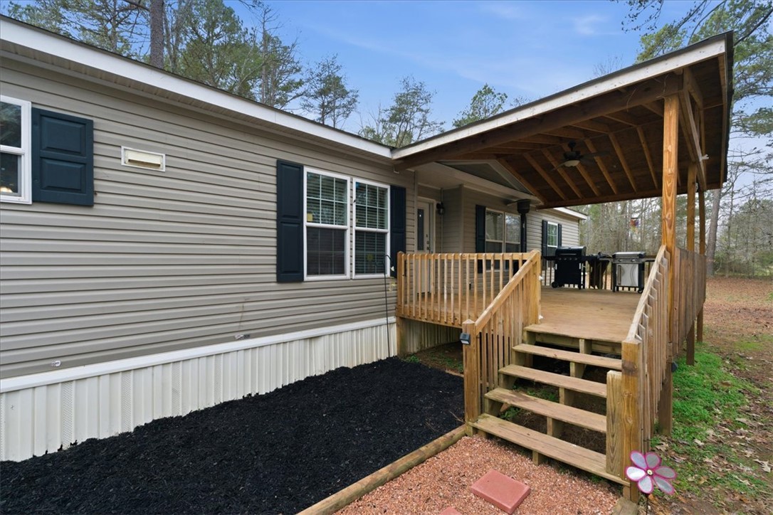 616 Anderson Road Pendleton, SC 29670 - Photo 3 of 29 This inviting outdoor space offers a covered deck perfect for relaxation and entertaining.