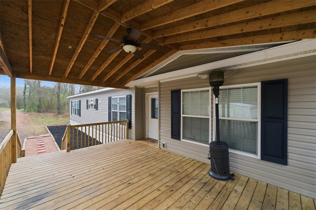 616 Anderson Road Pendleton, SC 29670 - Photo 5 of 29 Relax on this expansive outdoor deck, perfect for peaceful mornings or entertaining evenings.