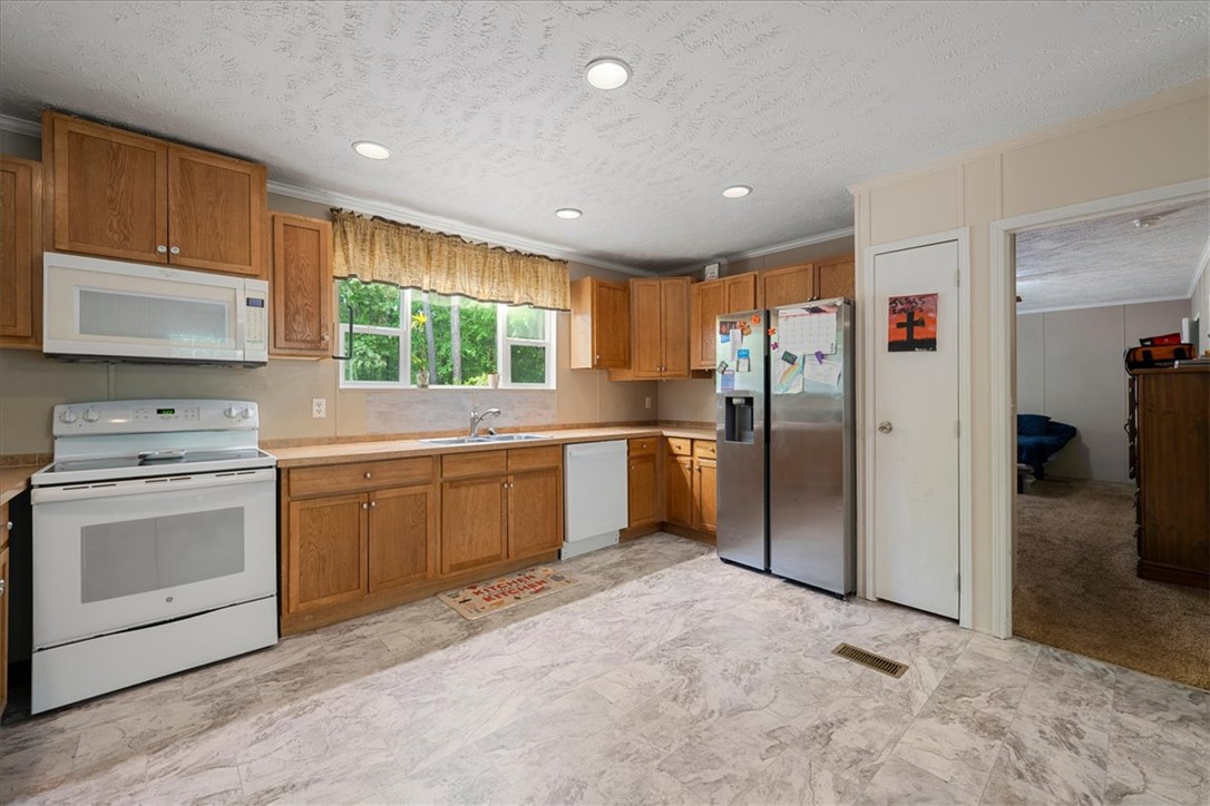 616 Anderson Road Pendleton, SC 29670 - Photo 6 of 29 Bright and inviting kitchen features ample cabinetry and a functional layout.