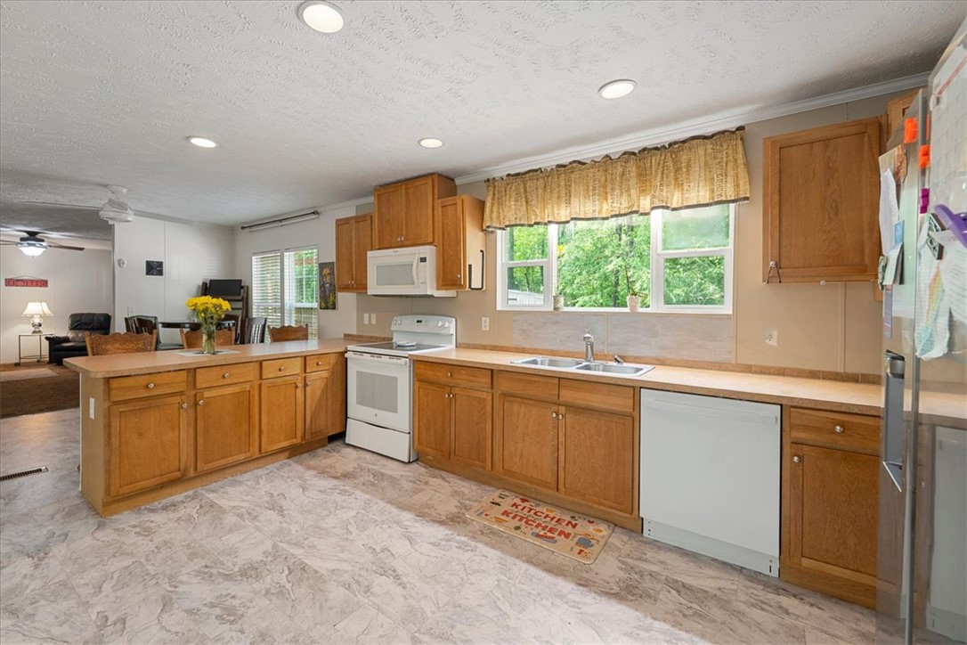 616 Anderson Road Pendleton, SC 29670 - Photo 7 of 29 This spacious kitchen offers a bright and inviting atmosphere for all your culinary endeavors.