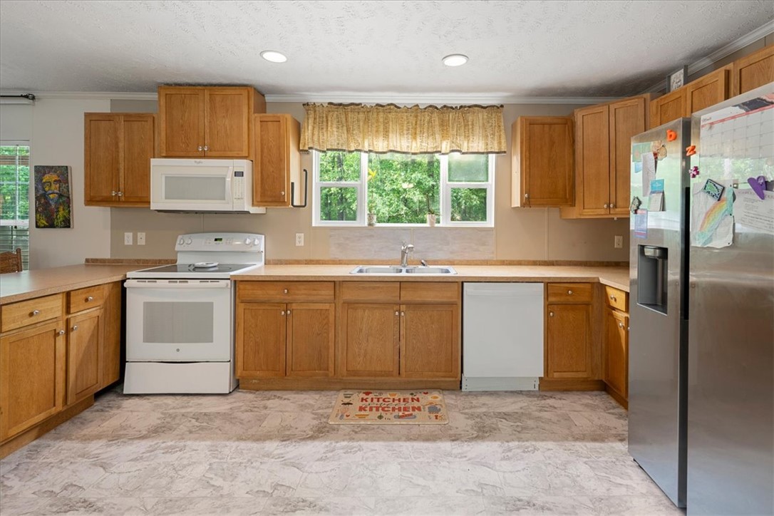 616 Anderson Road Pendleton, SC 29670 - Photo 8 of 29 This spacious kitchen offers ample cabinet and counter space for culinary pursuits.