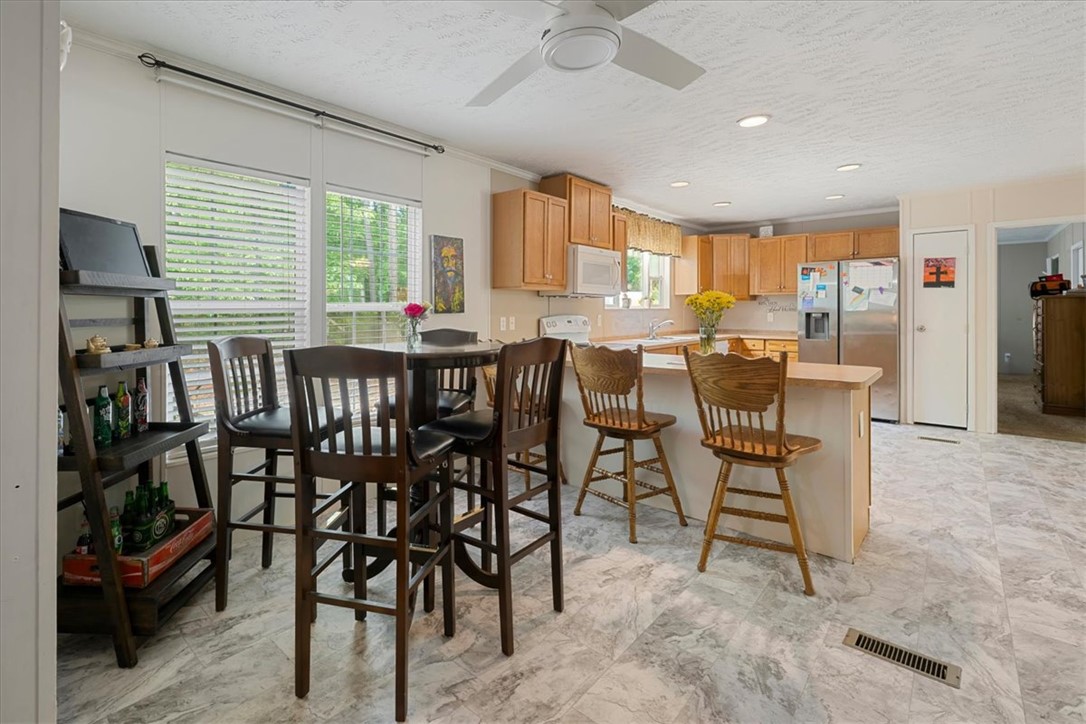 616 Anderson Road Pendleton, SC 29670 - Photo 10 of 29 This spacious kitchen offers a functional layout, ample cabinet space, and a bright dining area.