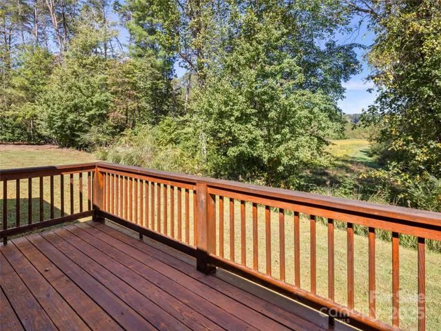 a view of balcony with wooden floor