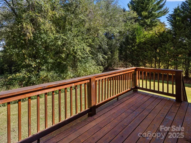 a view of balcony with wooden floor