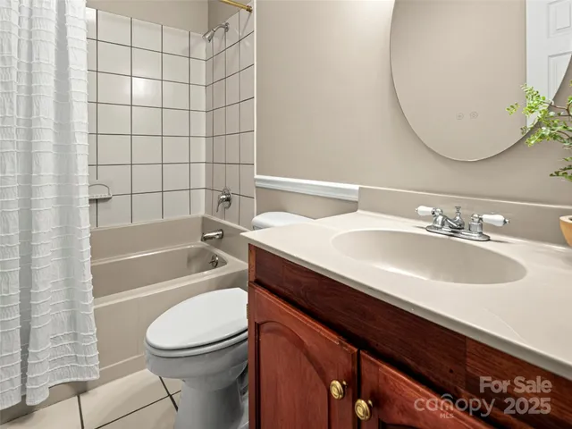 a bathroom with a sink a toilet and bathtub