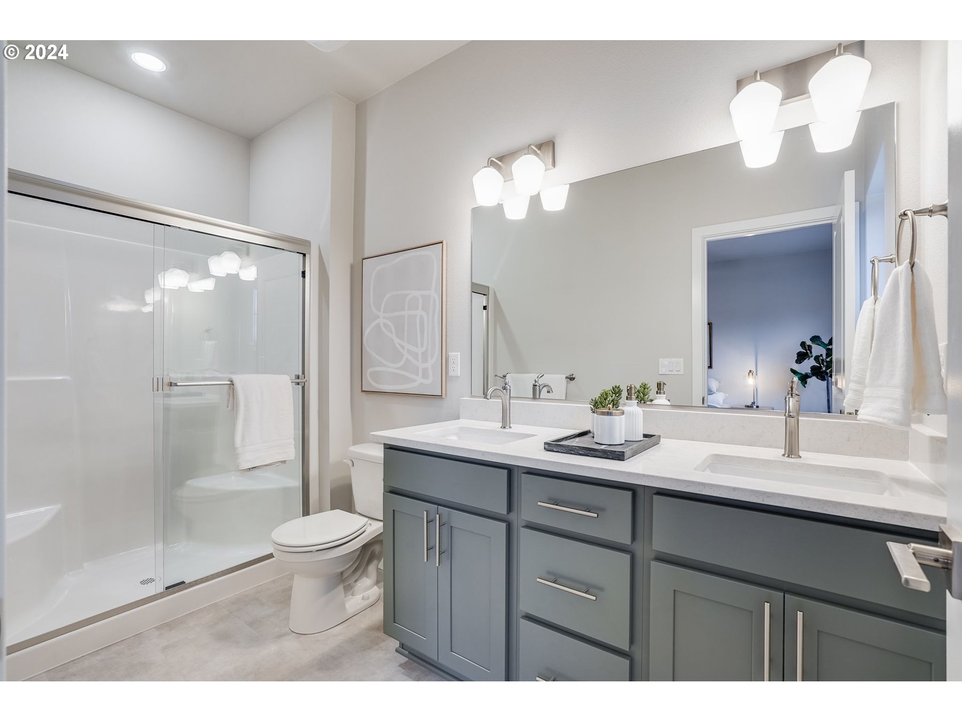 13167 Southwest Carmel Street Tigard, OR 97224 - Photo 32 of 48 a bathroom with a double vanity sink mirror double shower and a toilet