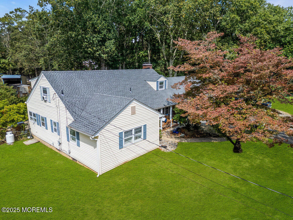 an aerial view of house with yard