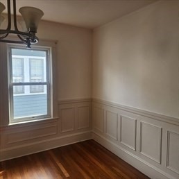 107 Wrentham Street, Unit 2 Boston, MA 02124 - Photo 12 of 20 a view of empty room with wooden floor and fan