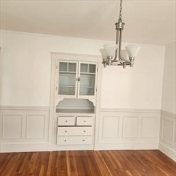 107 Wrentham Street, Unit 2 Boston, MA 02124 - Photo 13 of 20 a view of empty room with cabinet and wooden floor