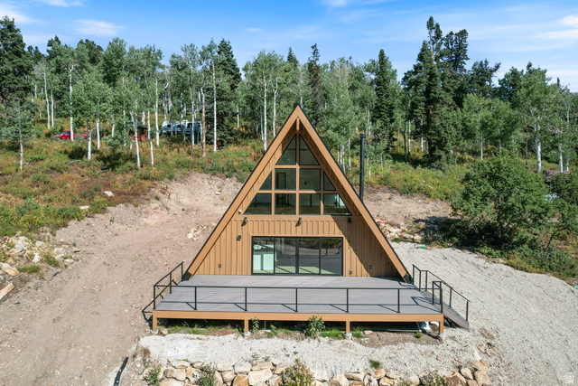 1833 Pine Loop Road Coalville, UT 84017 - Photo 20 of 26 A-frame residence with a triangular window wall and a prominent wood-tone exterior