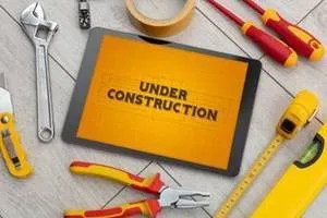 a view of a swimming pool with a couch and wooden floor