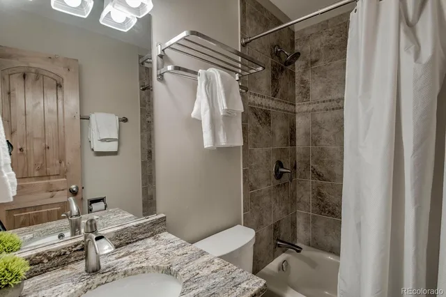 a view of a storage & utility room with two washing machine
