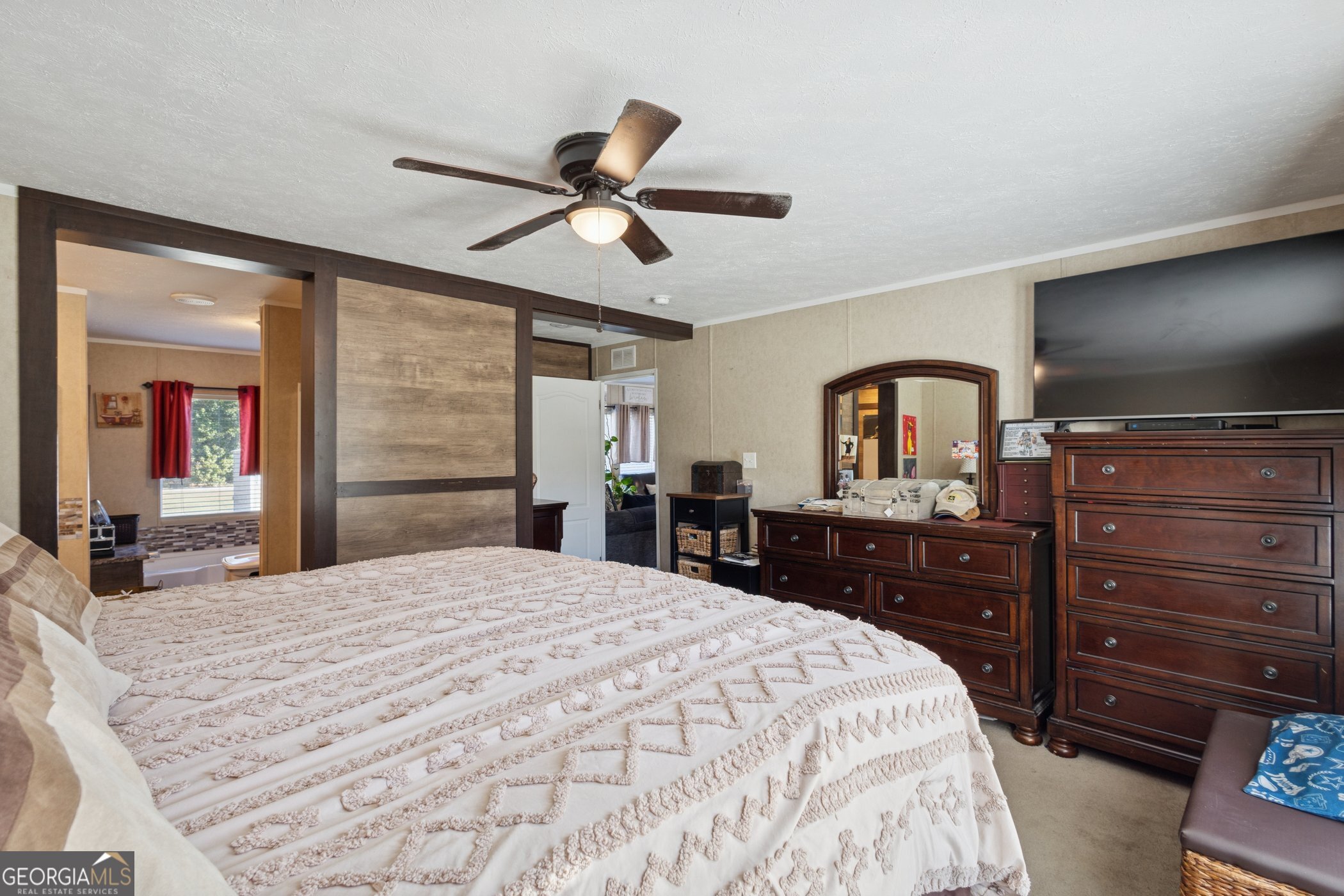 1238 Reedsville Road Clyo, GA 31303 - Photo 16 of 30 a bedroom with a bed and a flat screen tv