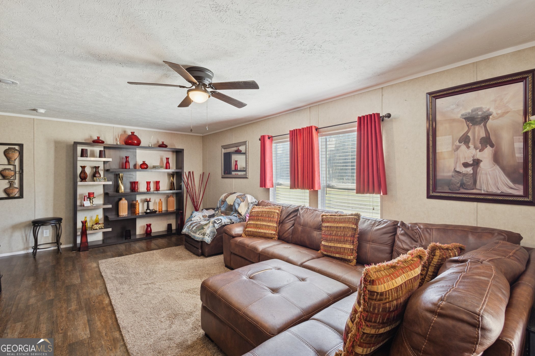 1238 Reedsville Road Clyo, GA 31303 - Photo 2 of 30 a living room with furniture a couch and a bookshelf